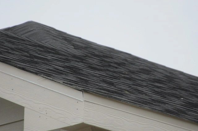 Asphalt shingle roof on a newly constructed home in Manvel, Texas, photographed during a pre-sheetrock home inspection